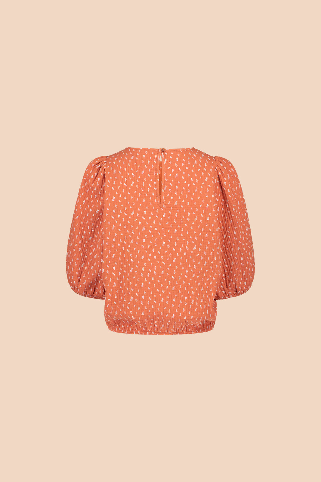 Naisten oranssi puuvillapaita minimalistisella kuosilla